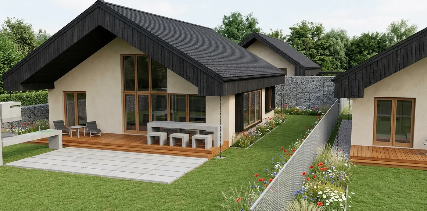 Rückseitige Terrasse des 99-m²-Hauses mit Außenesstisch aus Beton und Sonnenliegen